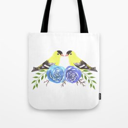 American goldfinch on roses Tote Bag
