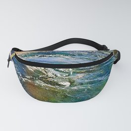 Colored sea waves licking the rock Fanny Pack