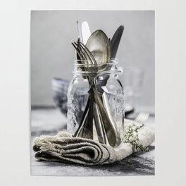 Forks spoons and knifes in a glass jar on grey vintage background Poster