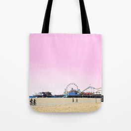 Santa Monica Pier with Ferries Wheel and Roller Coaster Against a Pink Sky Tote Bag